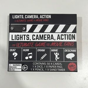 Lights , camera . Action game , pre-owned like new
